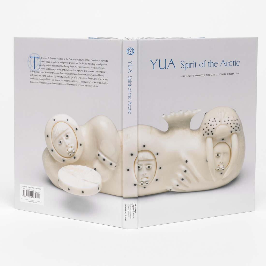 Cover of the book 'YUA: Spirit of the Arctic' featuring a white sculpture with black dots, likely a piece of Arctic art.