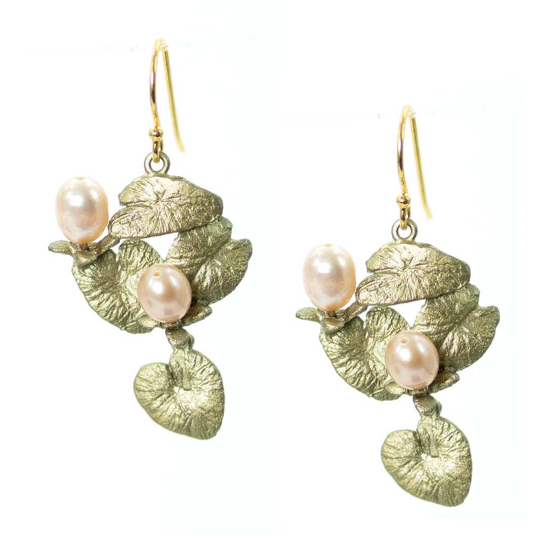 Gold leaf earrings with pearl-like beads on a white background