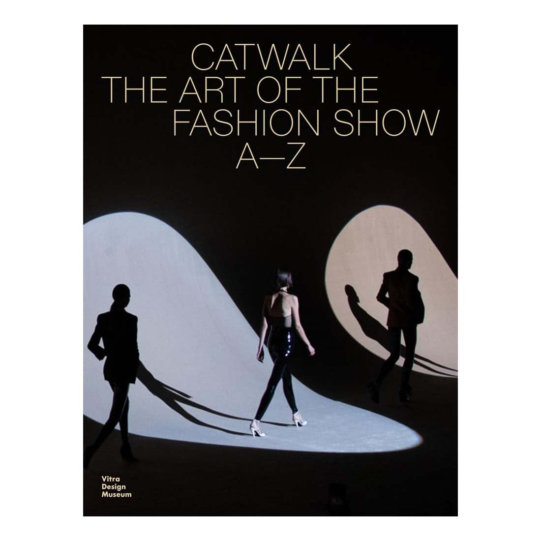 Book cover of 'Catwalk: The Art of the Fashion Show A-Z' with silhouettes of models on a black background.