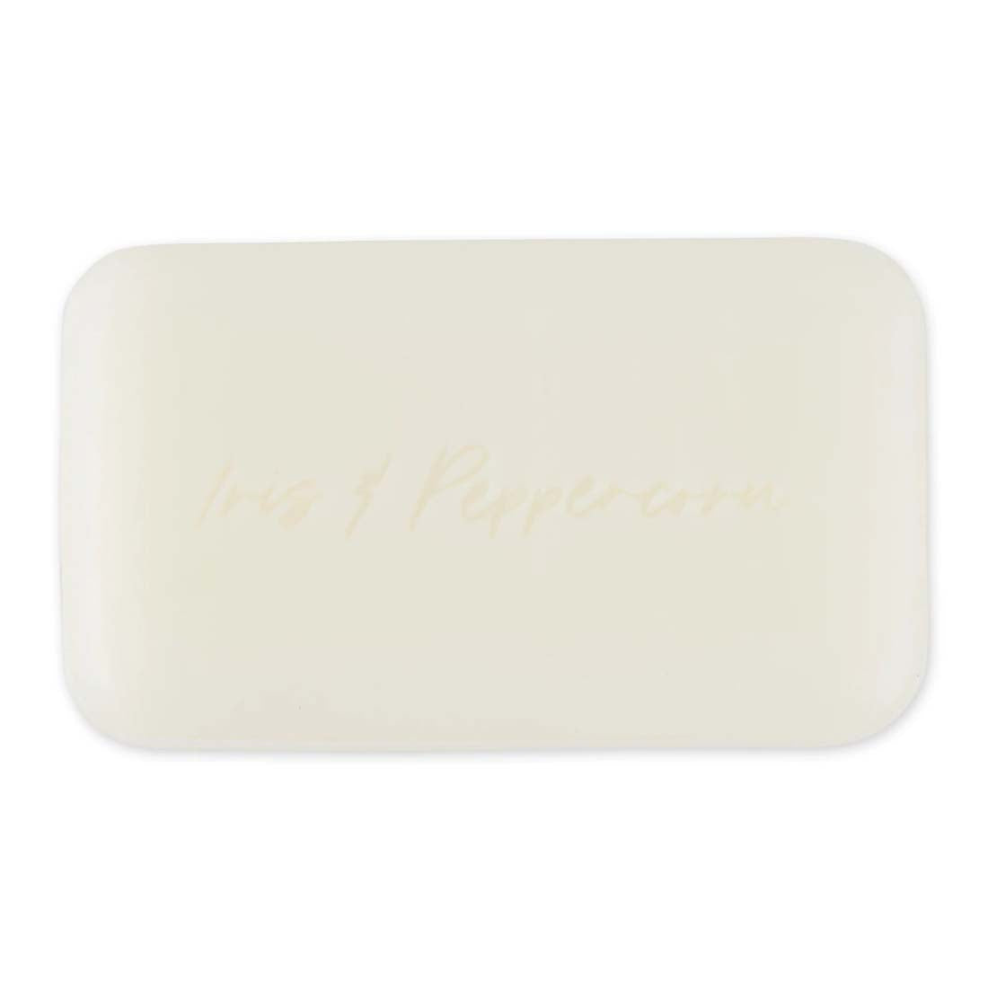 Pre de Provence soap bar with floral design on a pink background
