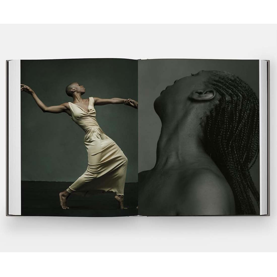 Open book showing a black and white photo of a woman in a flowing dress and a close-up of braided hair.