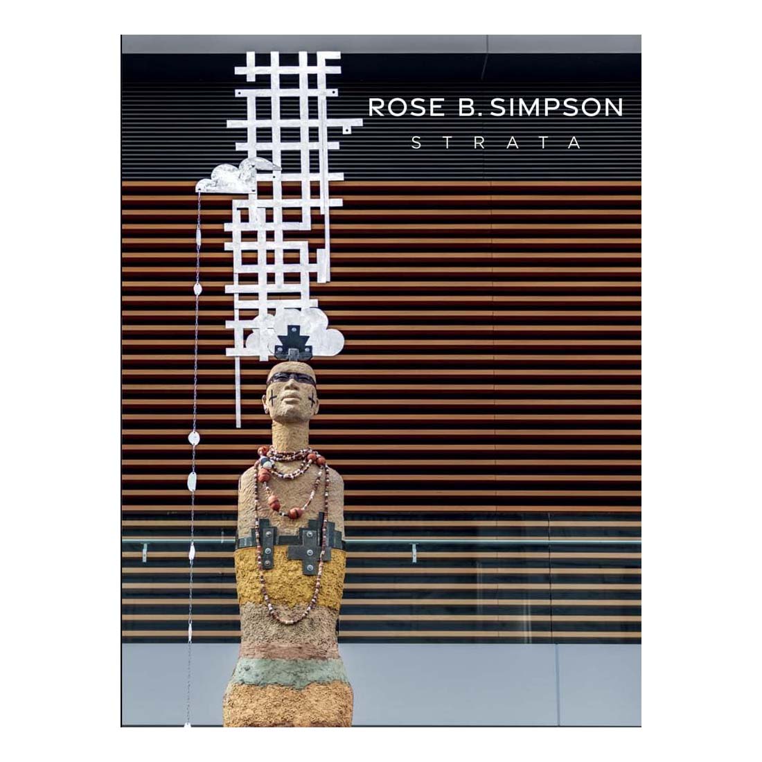 Cover of the book 'Rose B. Simpson: Strata' featuring a photograph of a ceramic art piece by the artist, set against a wooden panel background with a title banner.
