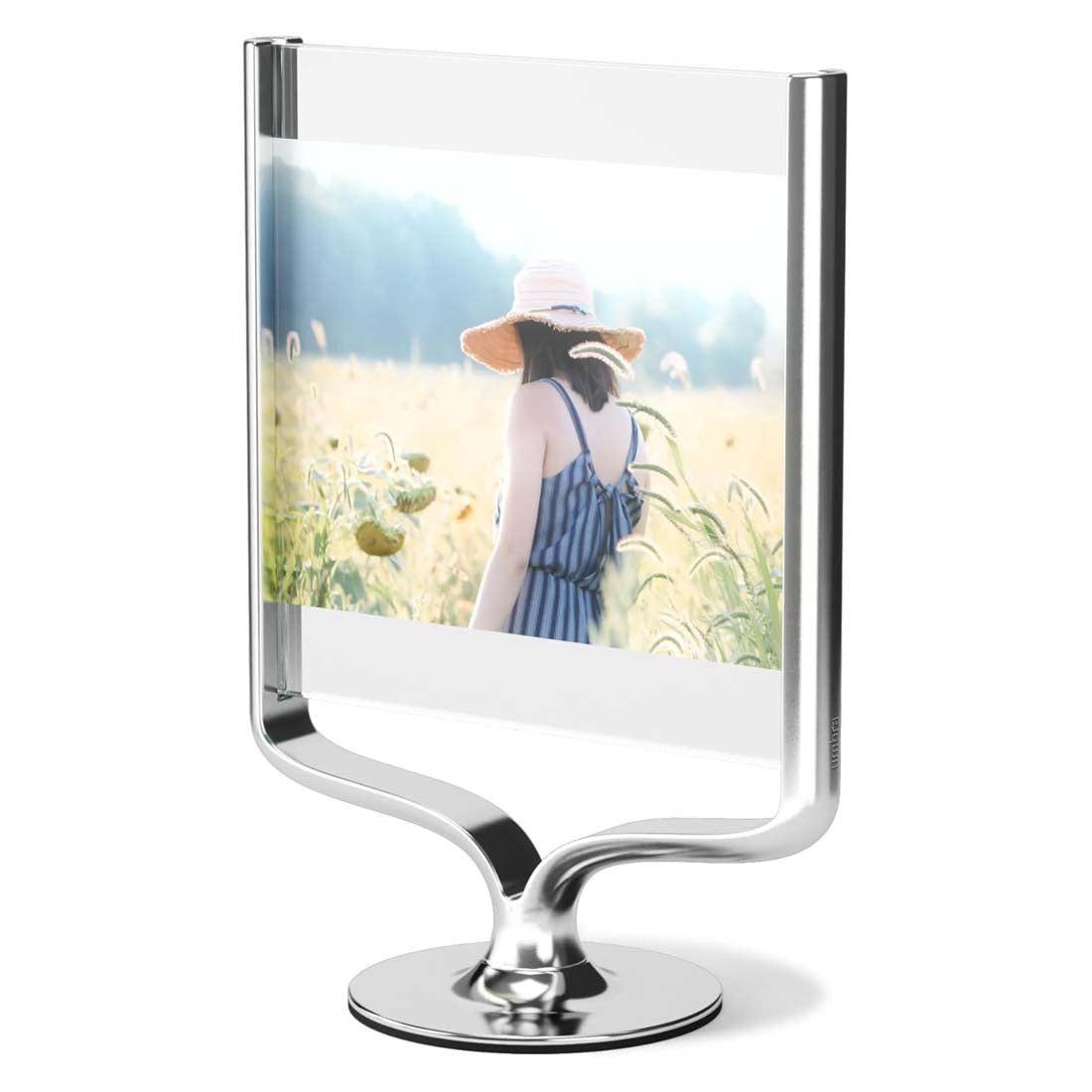 A silver, trophy-inspired, wishbone-shaped picture frame displaying a photo of a person in a field.