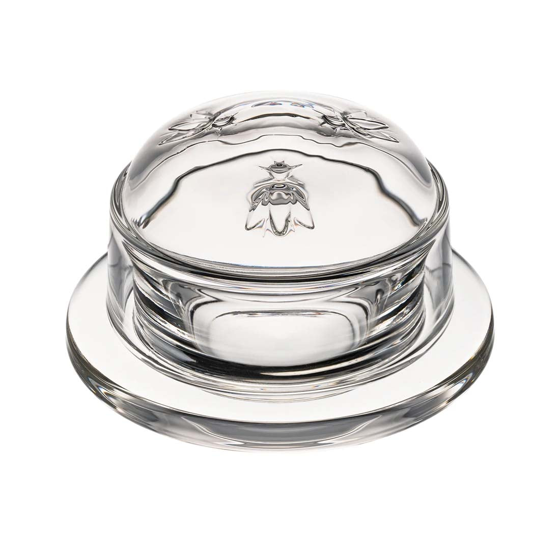 Clear glass butter dish with lid on a white background
