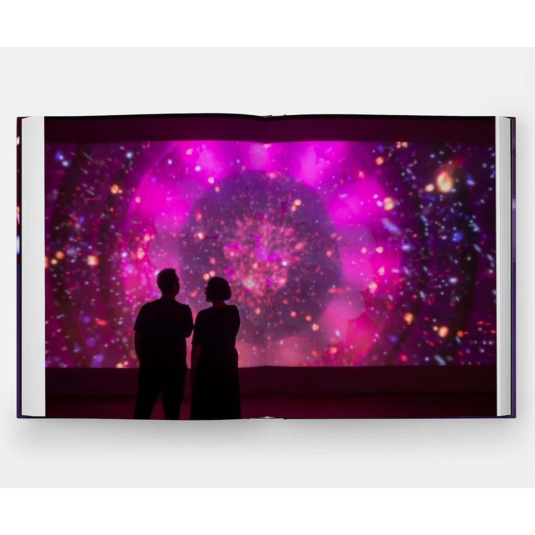 Book cover of 'Coding Light' by Leo Villareal with a silhouette against colorful light design.