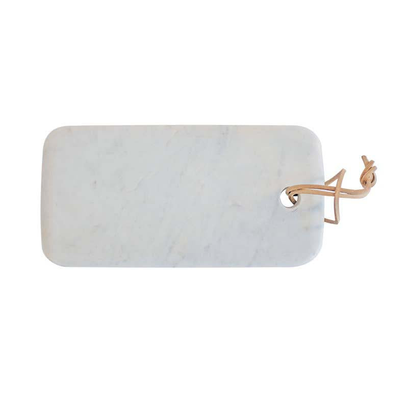 Rectangular marble cutting board with a gold handle on a white background