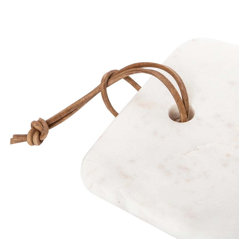 Long, narrow marble slab with a rope handle on a white background