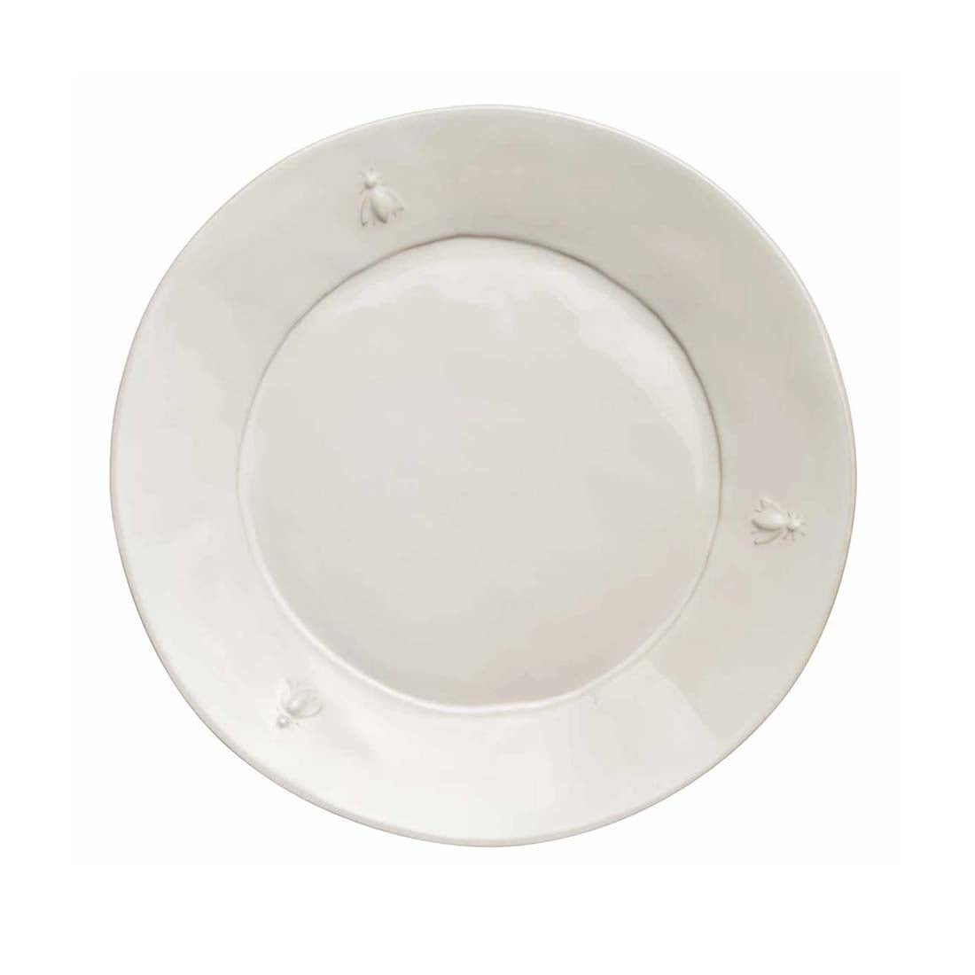 White ceramic plate with decorative elements on a white background