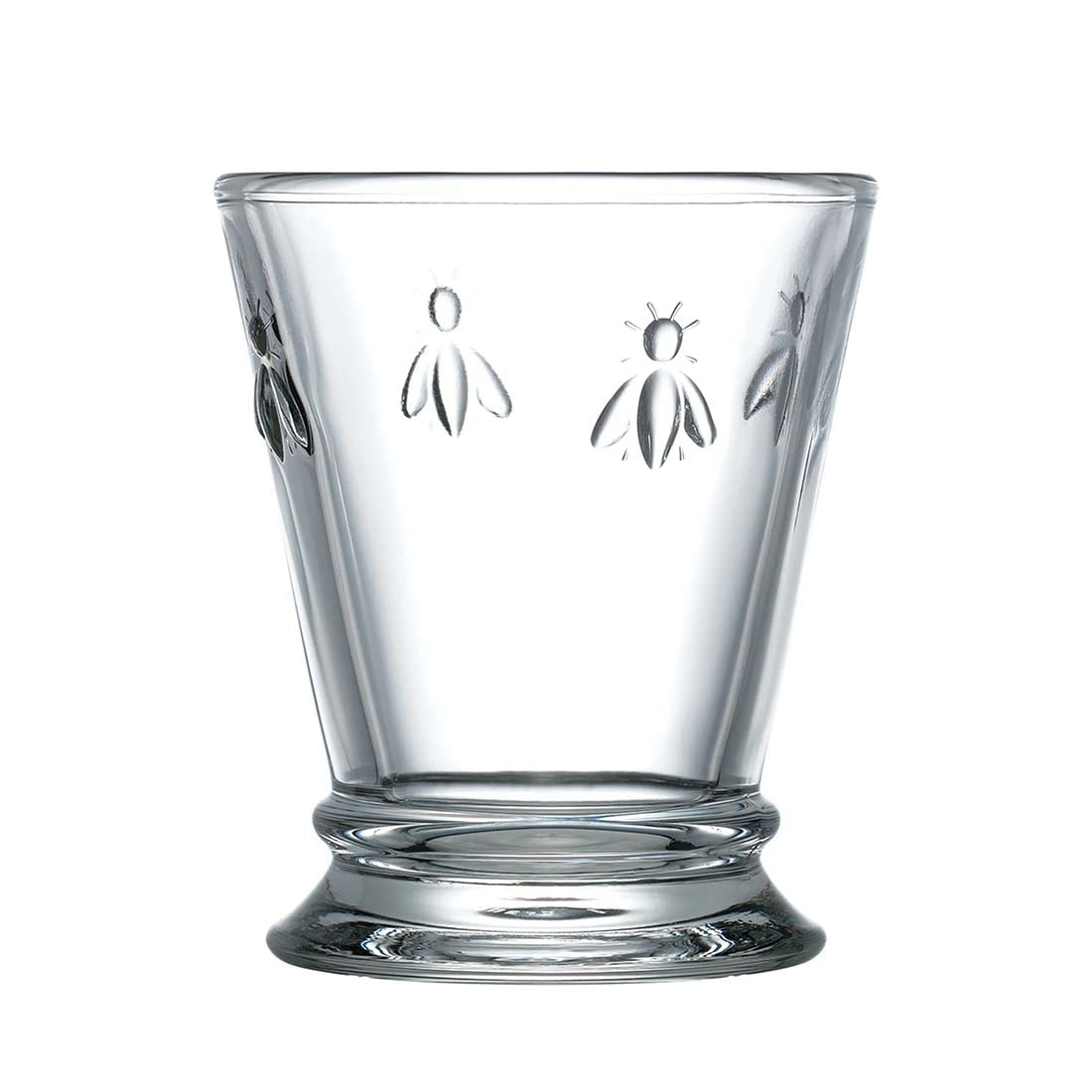 Clear glass tumbler with engraved bee designs on a white background