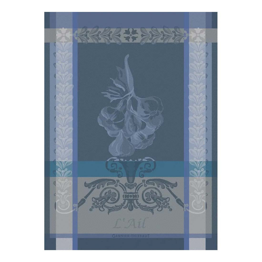 Decorative kitchen towel with onion design and floral border on a blue background