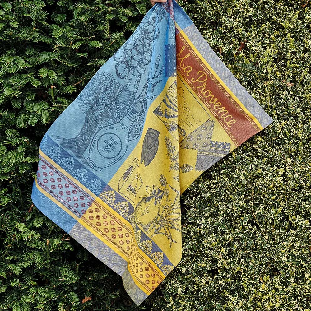 Colorful towel with 'Ma Provence' text and illustrations on a white background