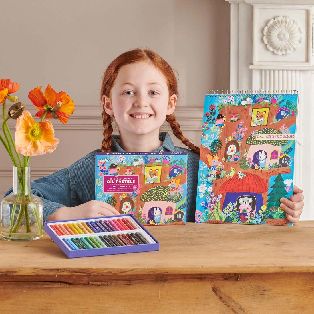 Colorful children's sketchbook with animal illustrations on a white background