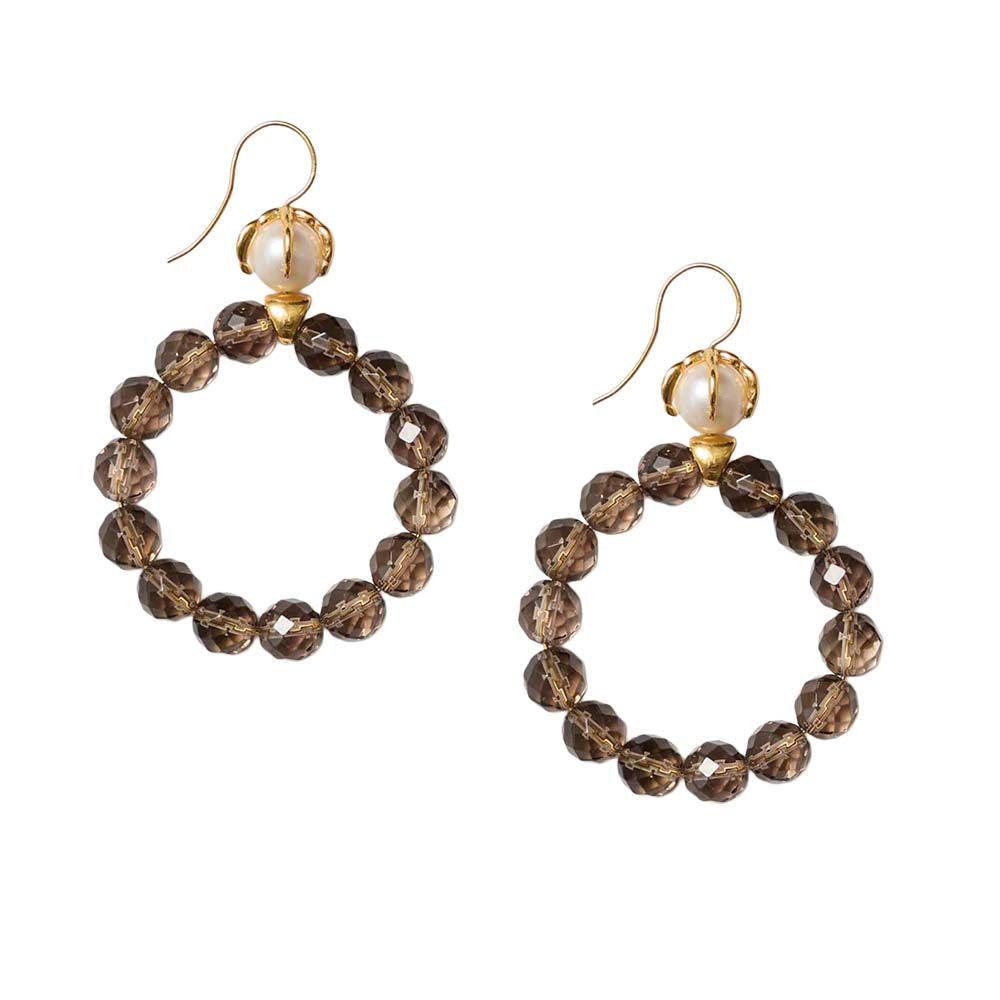 Pair of hoop earrings with brown beads and gold accents on a white background