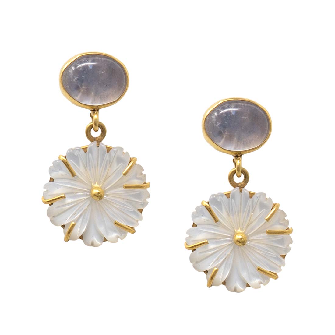 Pair of earrings with gold and white design on a white background