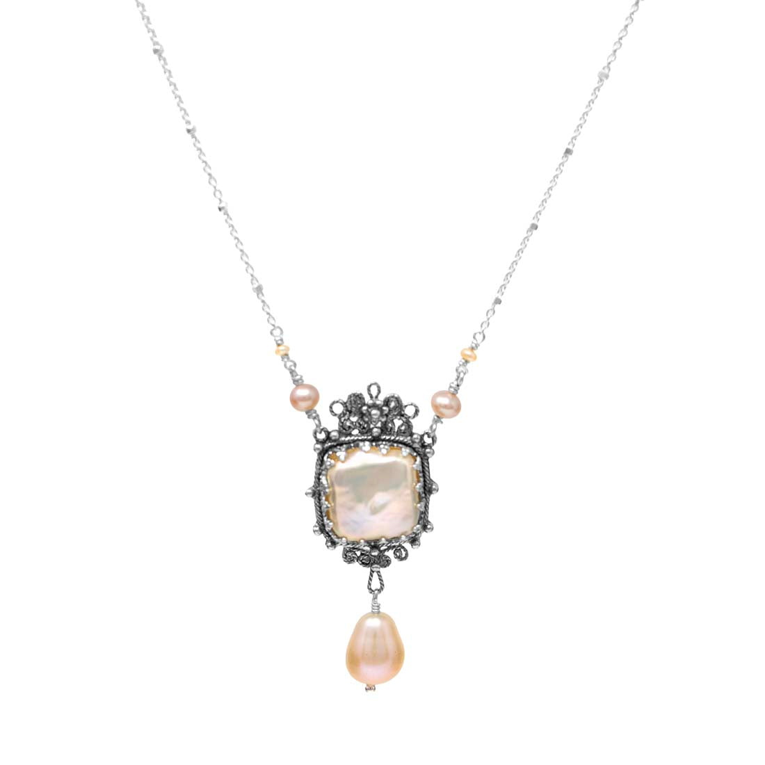 Necklace with a pendant featuring a large pearl and smaller beads on a white background