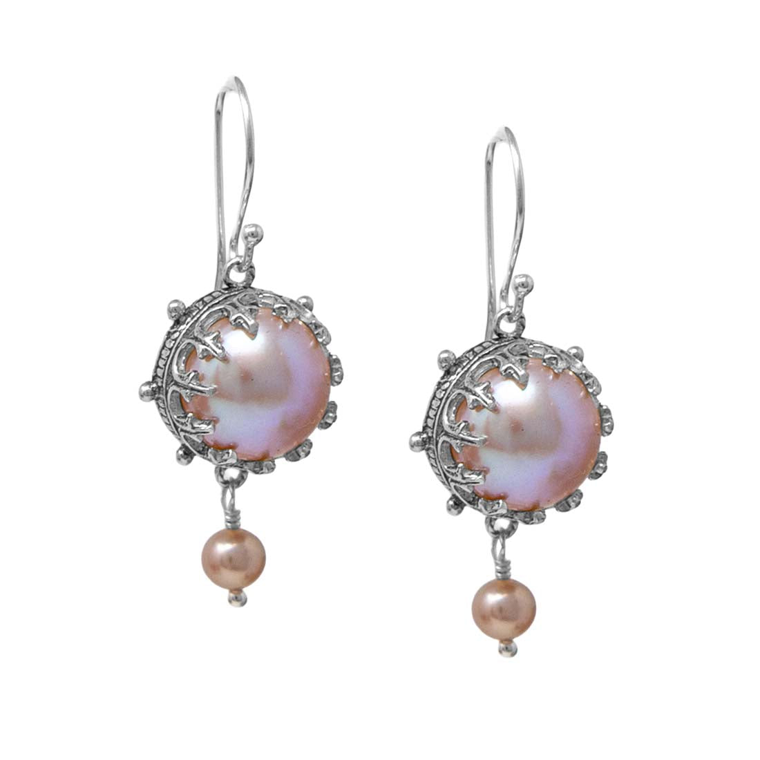 Pair of pearl earrings with silver fixtures on a white background