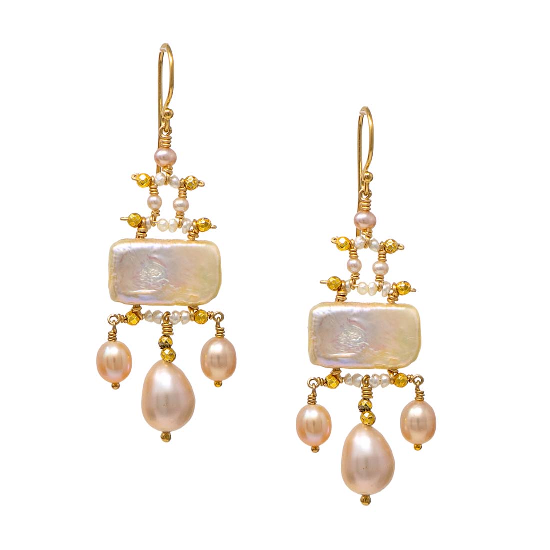 Pair of pearl and gold earrings on a white background