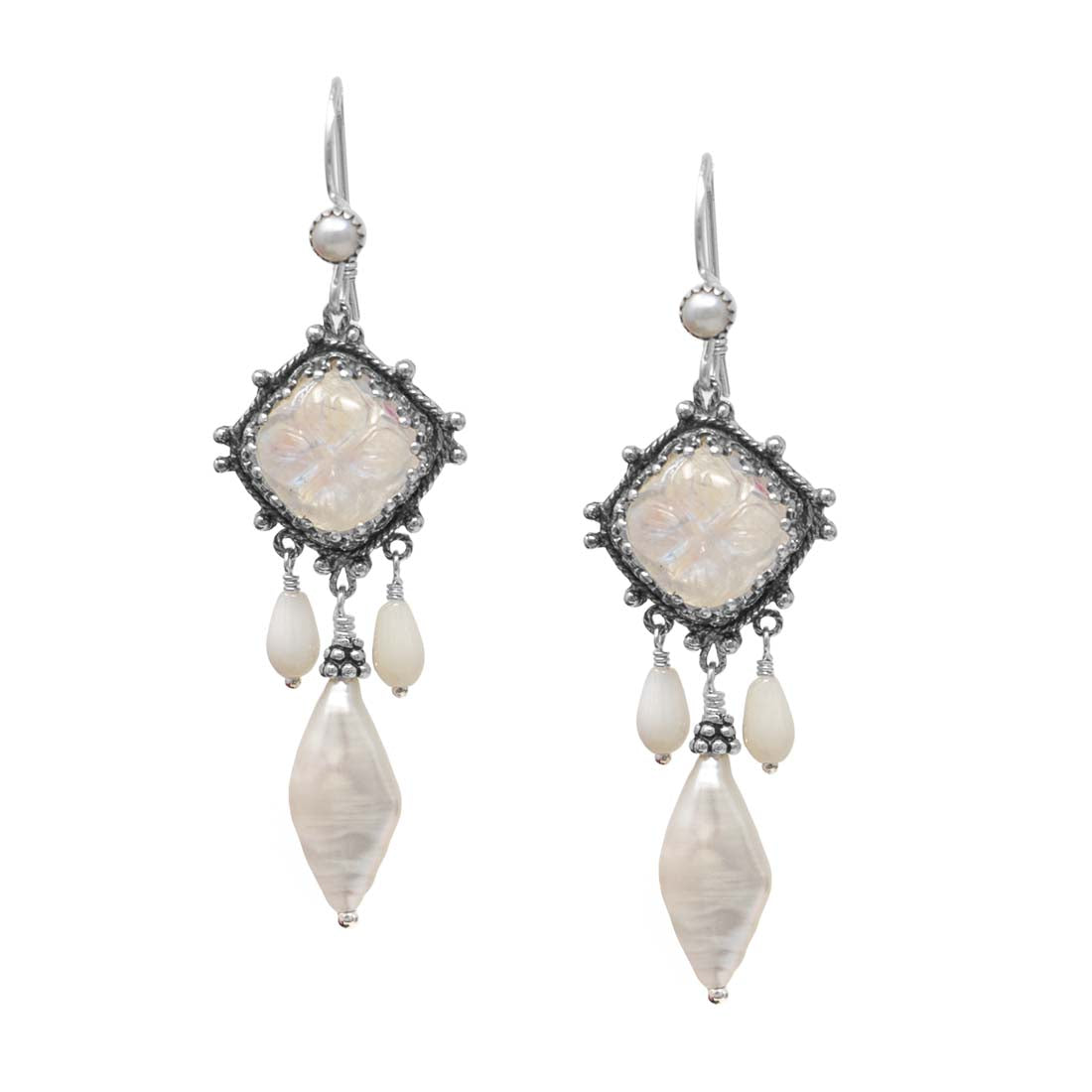 Pair of earrings with white stone and shell-like beads on a white background