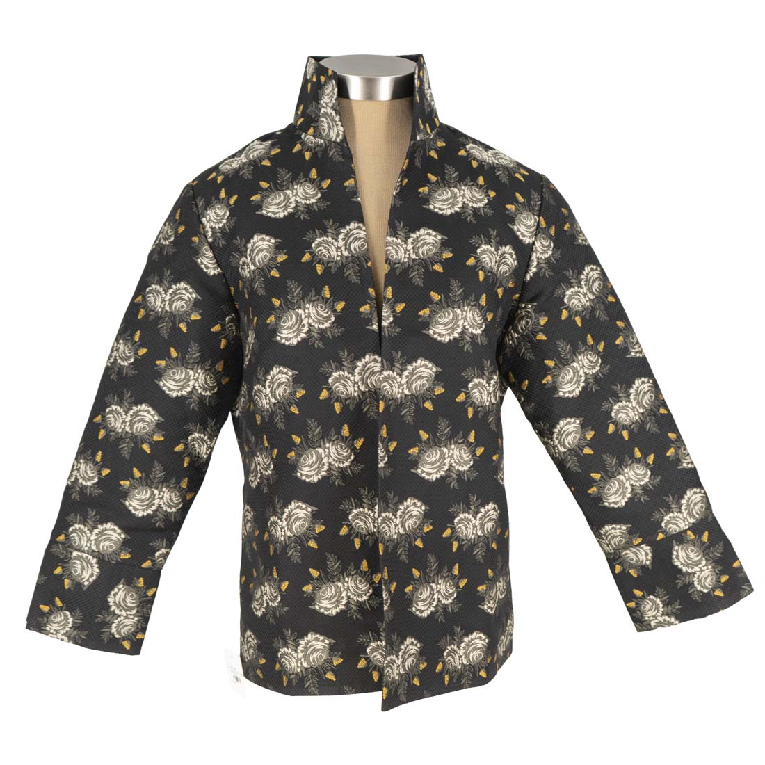 Floral patterned shirt on a mannequin against a white background