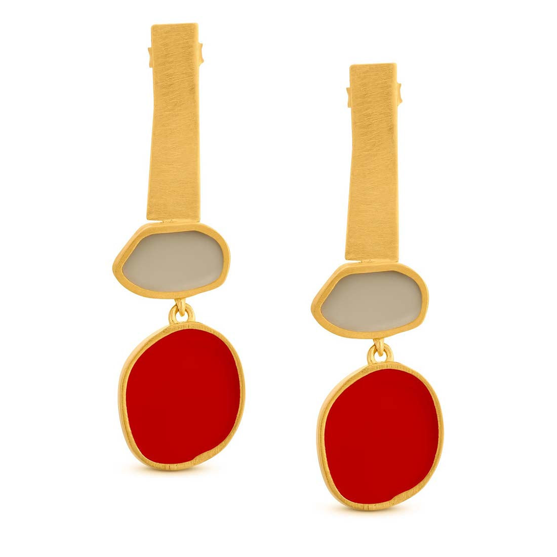 Gold and red earrings on a white background