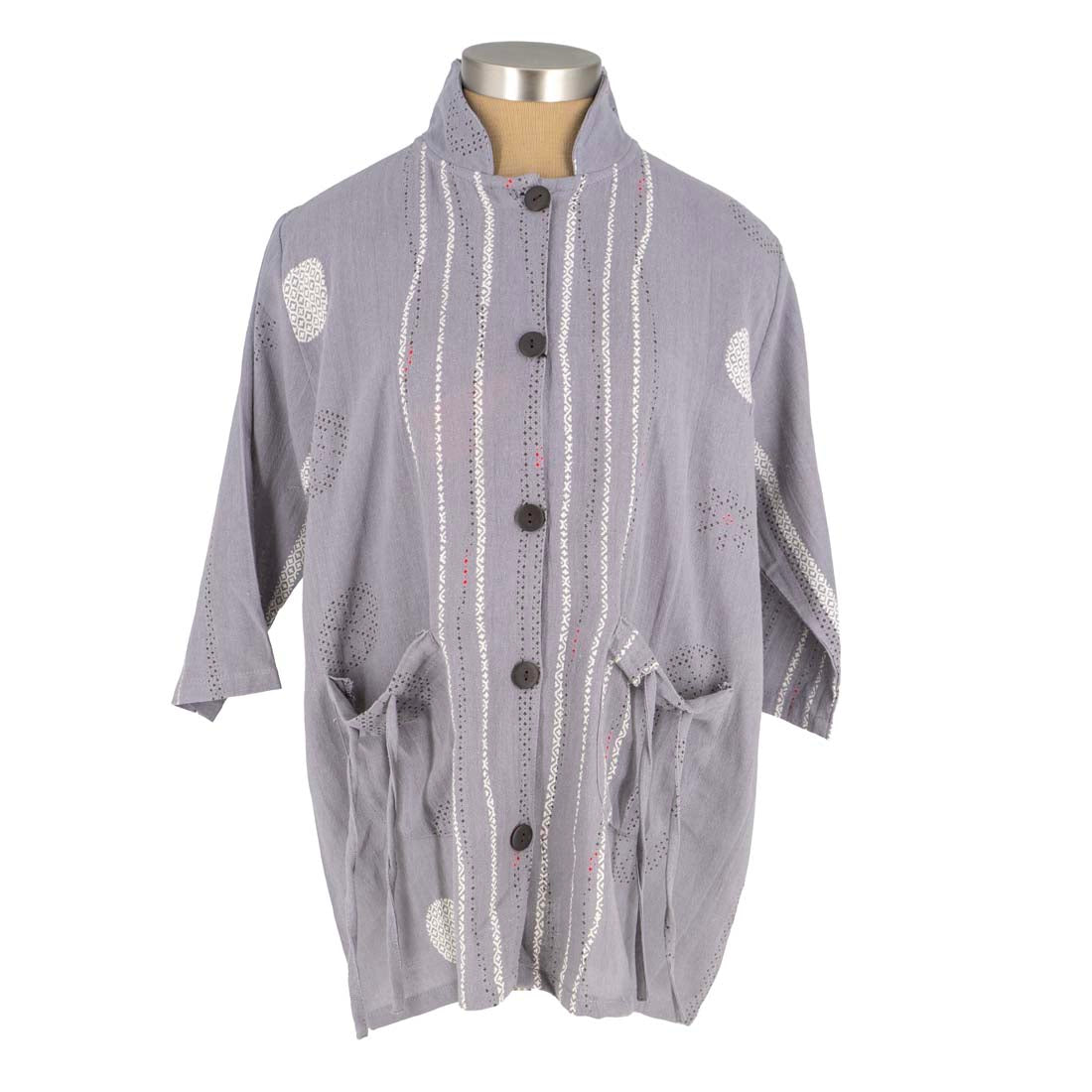 Gray cardigan with decorative buttons and patterns on a mannequin against a white background