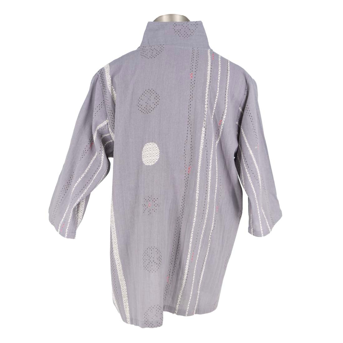 Gray cardigan with decorative buttons and patterns on a mannequin against a white background