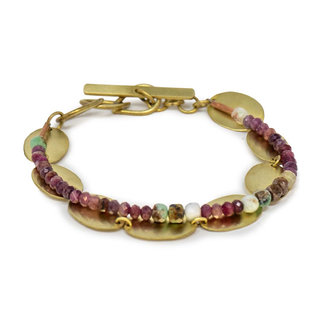 Bracelet with gold discs and multicolored beads on a white background