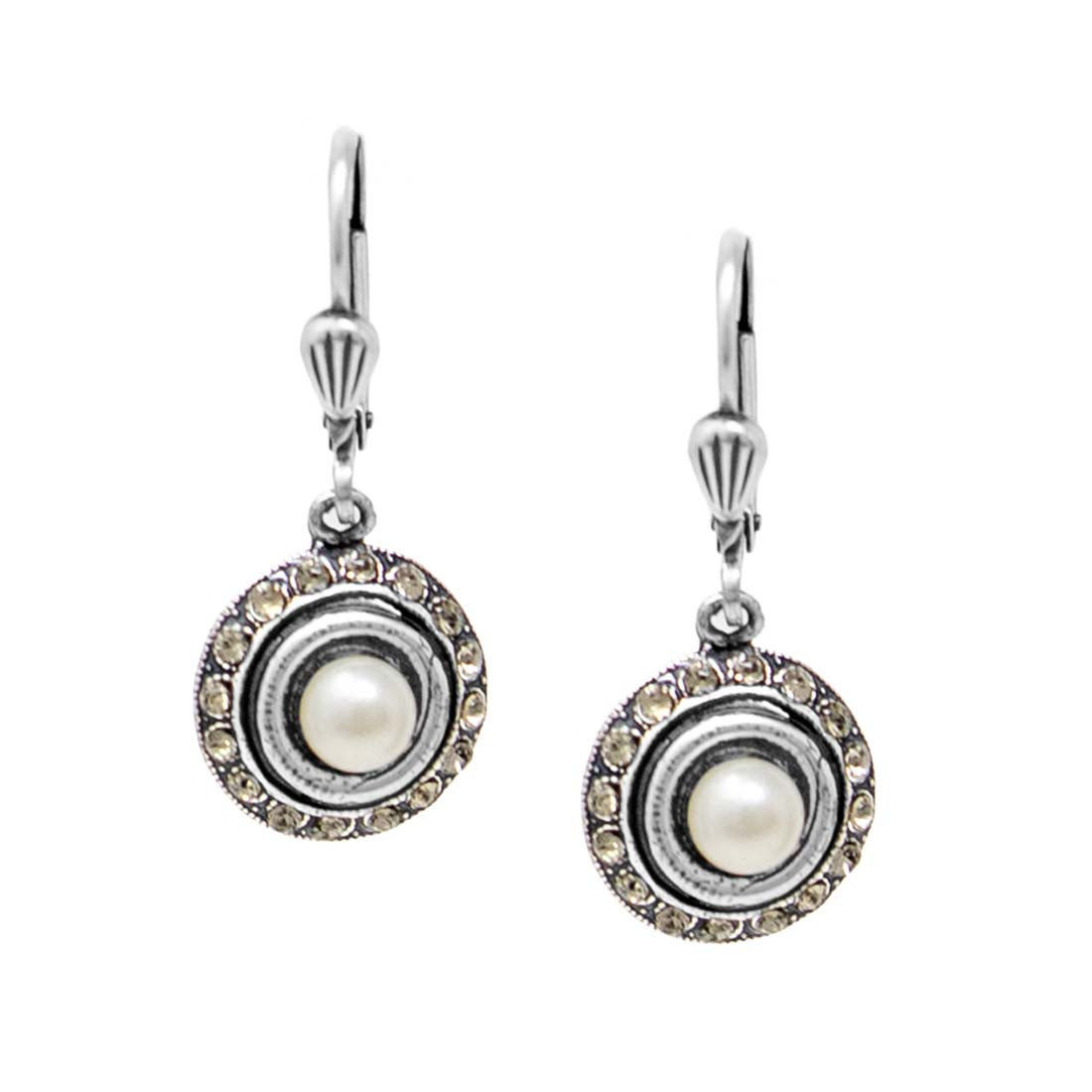 Pair of earrings with pearl center stones and silver accents on a white background