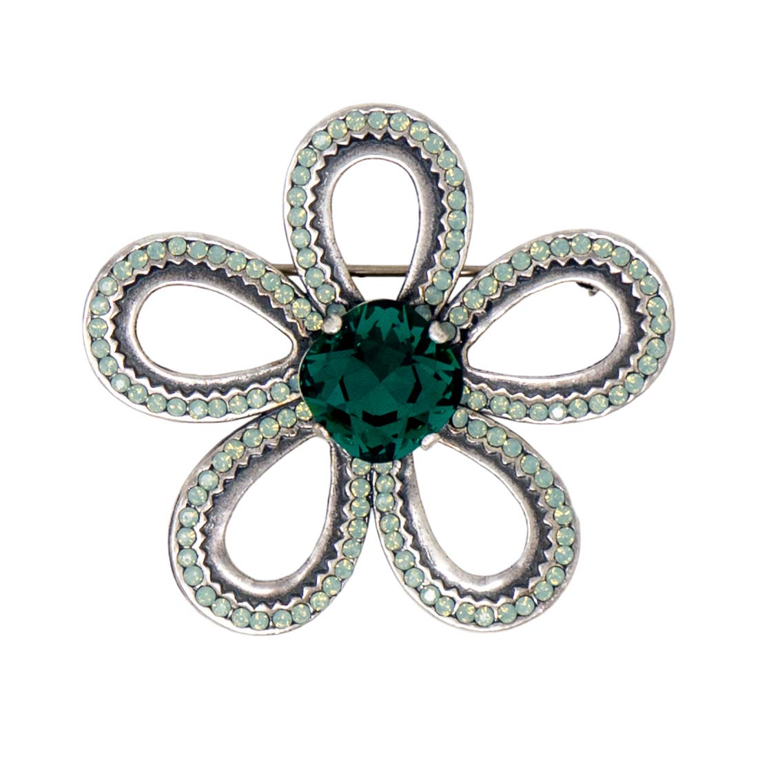 Silver flower-shaped brooch with a green heart center on a white background