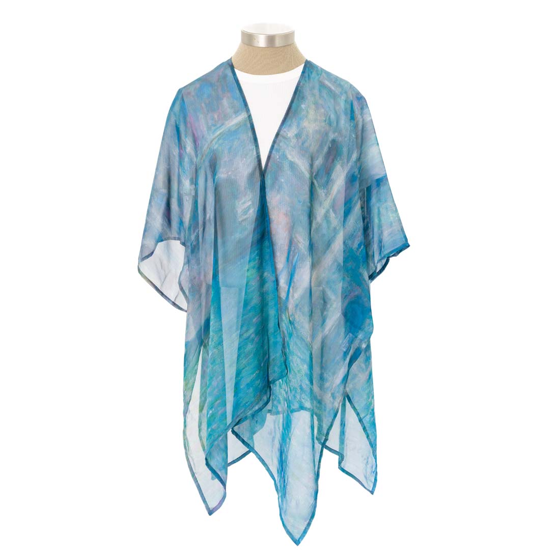 Blue and white patterned scarf on a mannequin against a white background