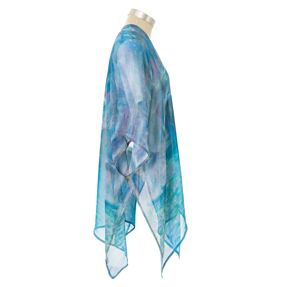 Blue and white patterned scarf on a mannequin against a white background