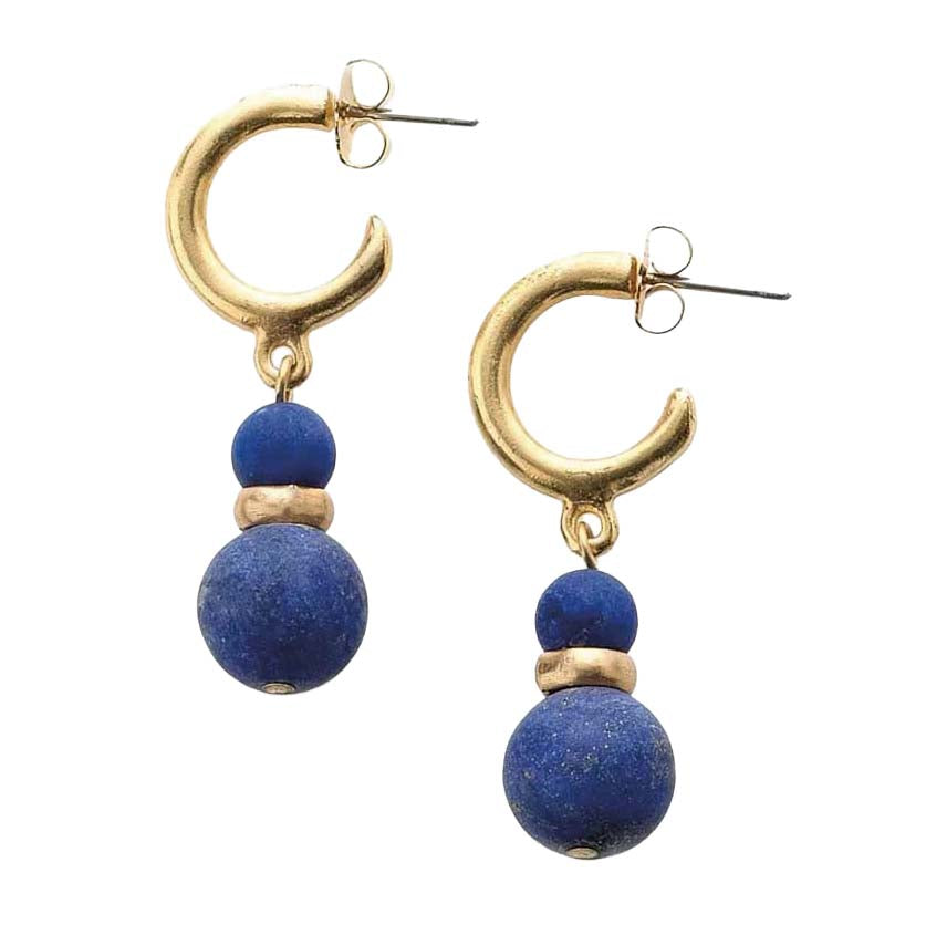 Gold hoop earrings with blue spherical beads on a white background