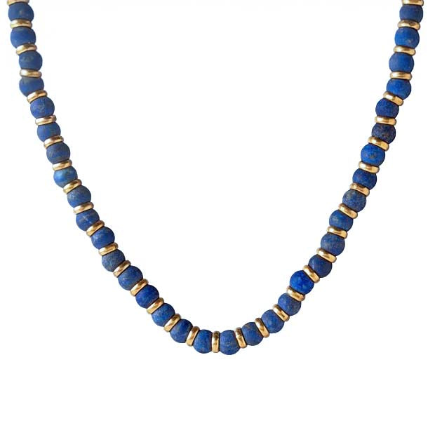 Necklace with blue beads and gold accents on a white background