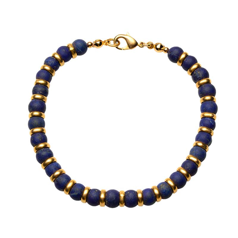 Bracelet with blue beads and gold accents on a white background