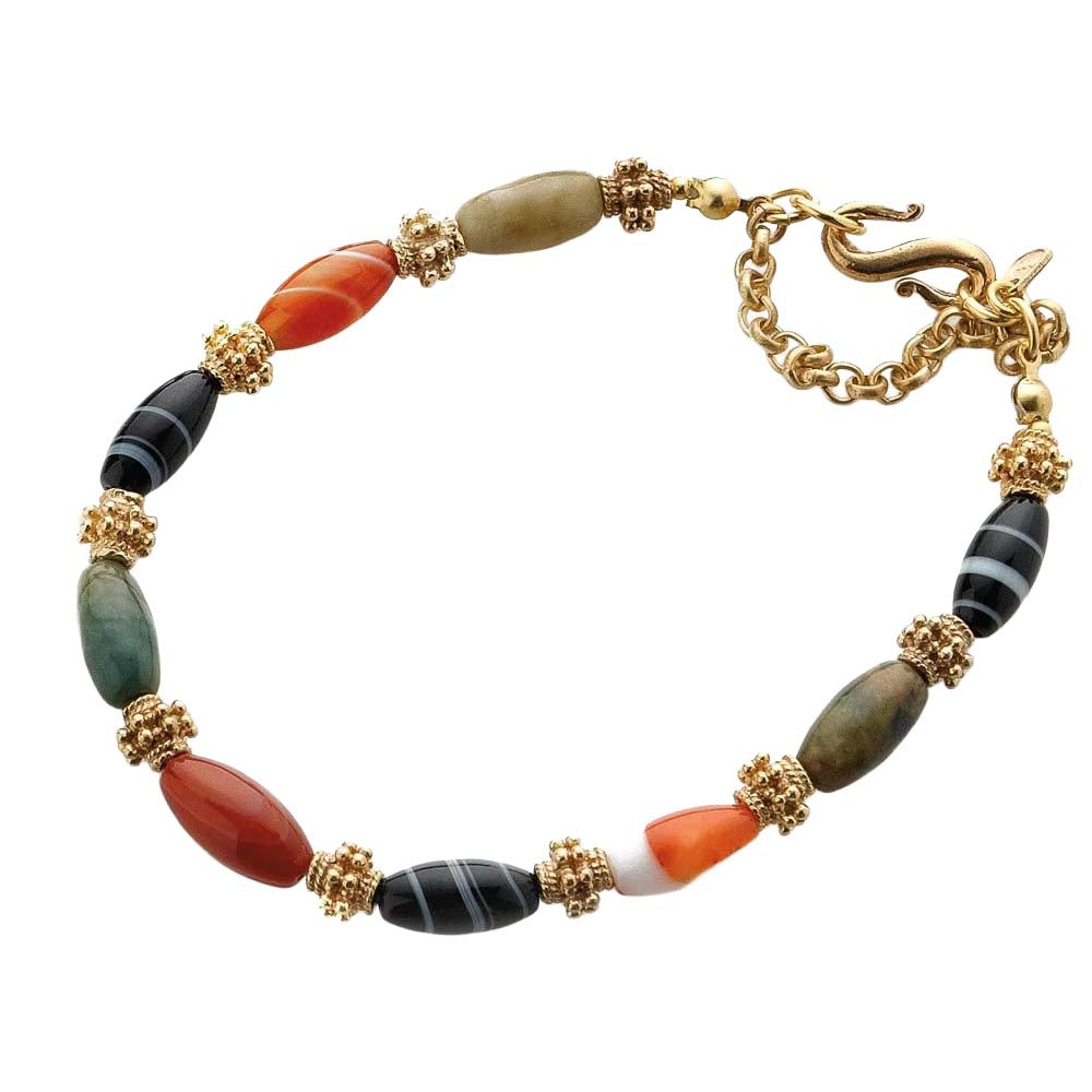 Bracelet with multicolored beads and gold accents on a white background