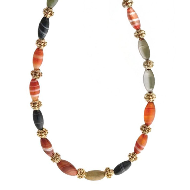 Necklace with multicolored beads and gold accents on a white background