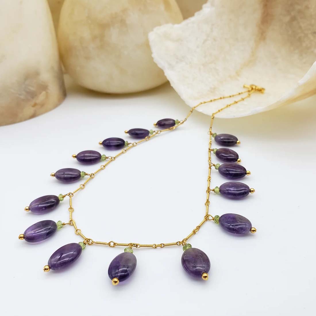 Necklace with purple beads on a white background