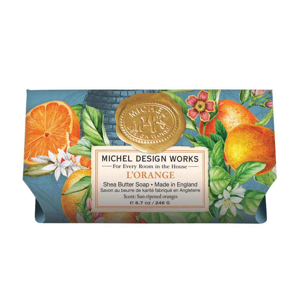 Bar of soap with orange design and Michel Design Works branding on a white background