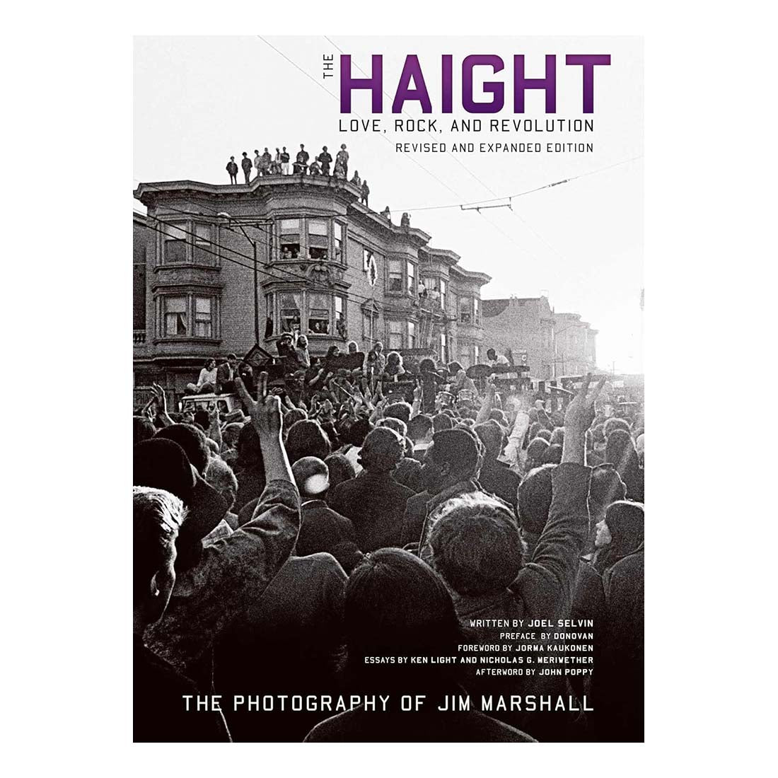Cover of the book 'The Haight: Love, Rock, and Revolution' featuring a black and white photograph of a crowded street scene in San Francisco with people celebrating.