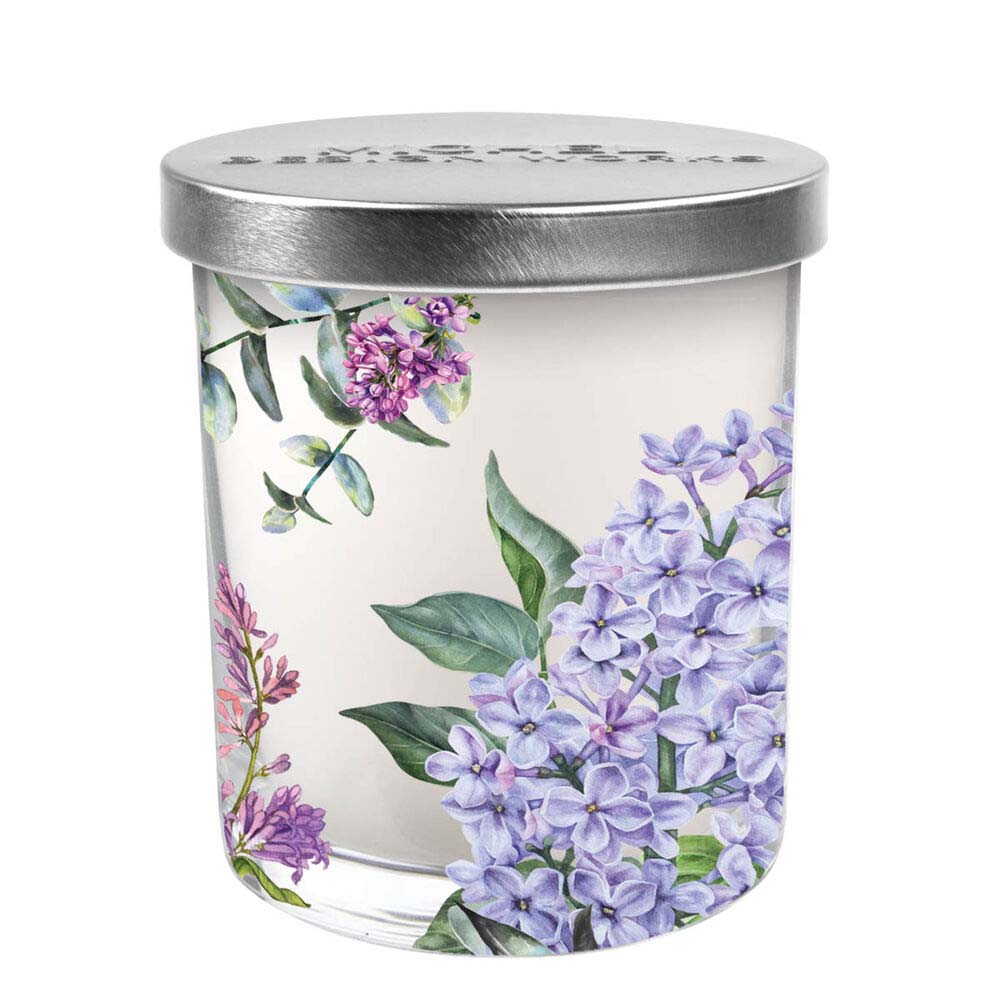 Candle jar with floral design and silver lid on a white background
