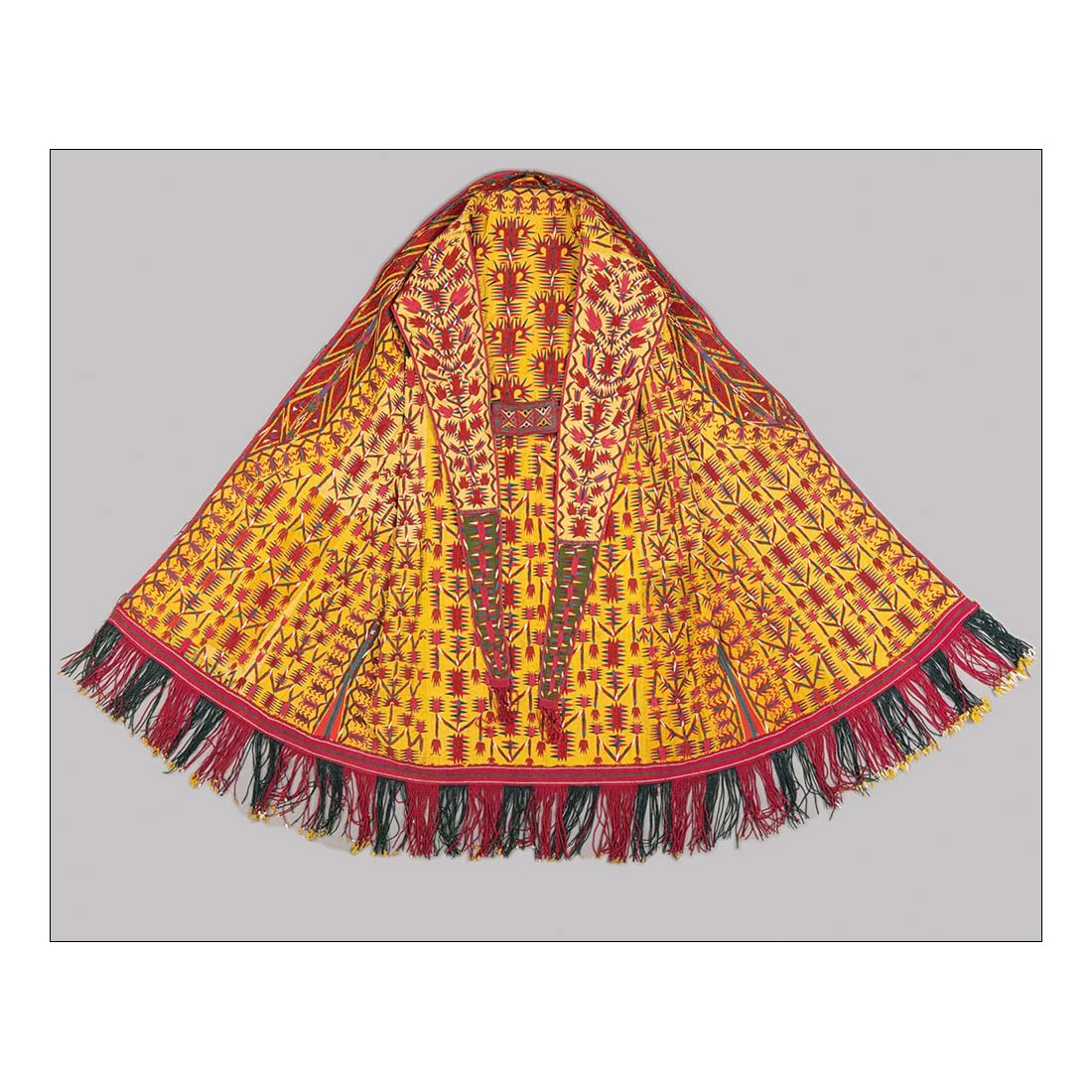 Book cover of 'Central Asian Textiles' featuring colorful textile patterns on a red background.