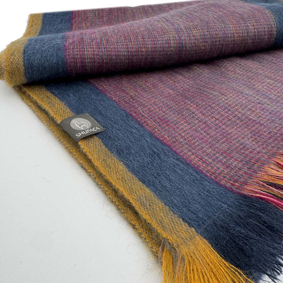 Striped scarf with purple, blue, and yellow colors on a white background