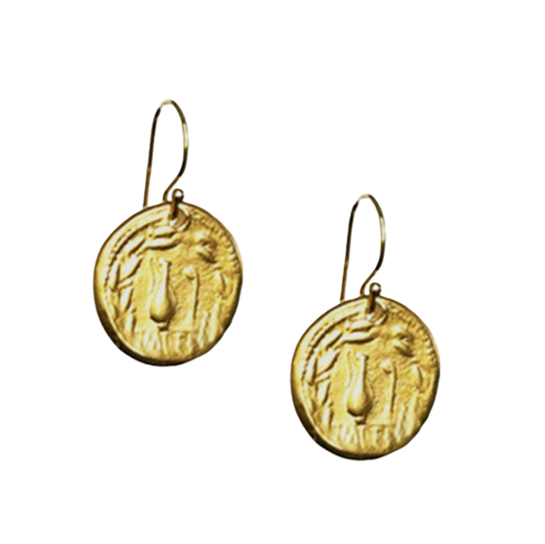 Gold earrings with circular designs on a white background