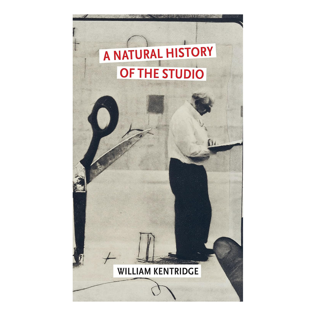 Book cover of 'A Natural History of the Studio' by William Kentridge with a black and white photo of a person and large scissors.