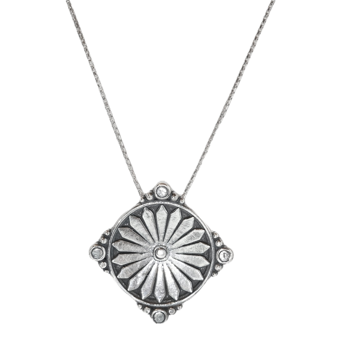 Silver necklace with a center floral burst design