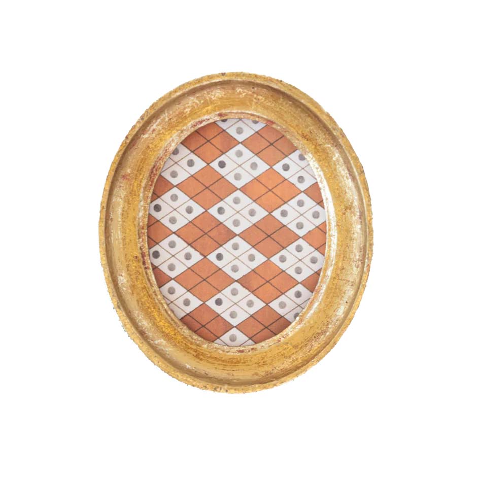 Decorative plate with a checkered pattern inside a gold frame on a white background