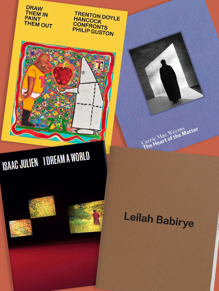 Collection of art books with colorful covers on a red background