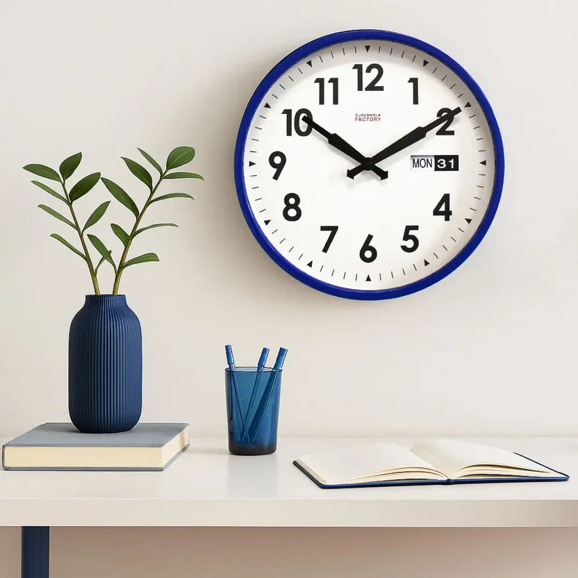 Wall clock with blue frame on a white background
