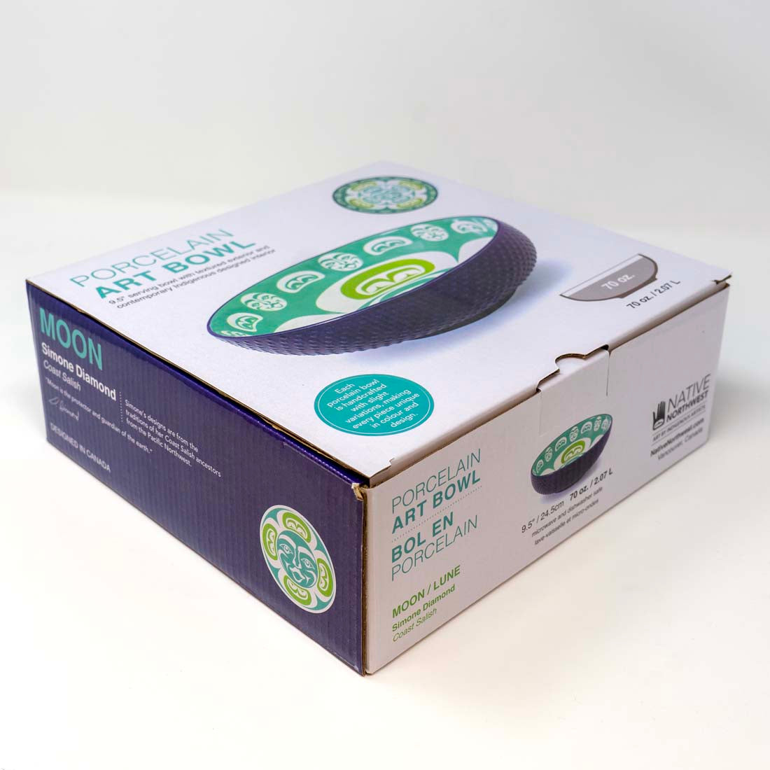 A porcelain serving bowl with a contemporary Indigenous design in green, blue, and white colors.