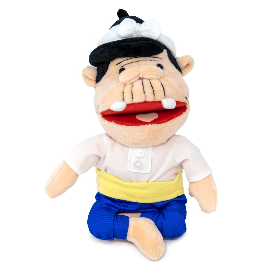 Plush toy of a character with a white shirt, blue pants, and a black and white hat on a white background